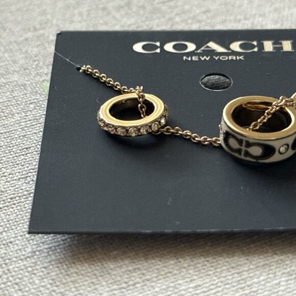 Coach Multi-Ring Pendant Necklace Gold Cream Black Enamel Crystal NWT 16”+2” - Picture 8 of 10